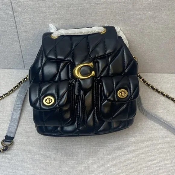 Coach Handbags - Coach Black and Gold Quilted Wallet